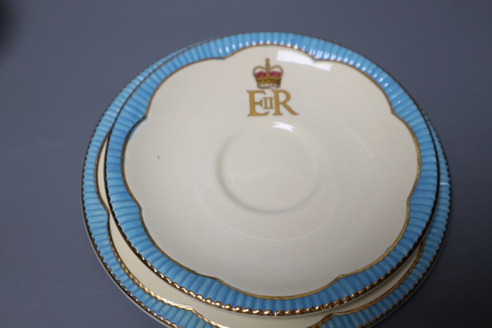 A Clarice Cliff Ravel pattern tea cup and saucer and a Queen Elizabeth II coronation trio, 1953